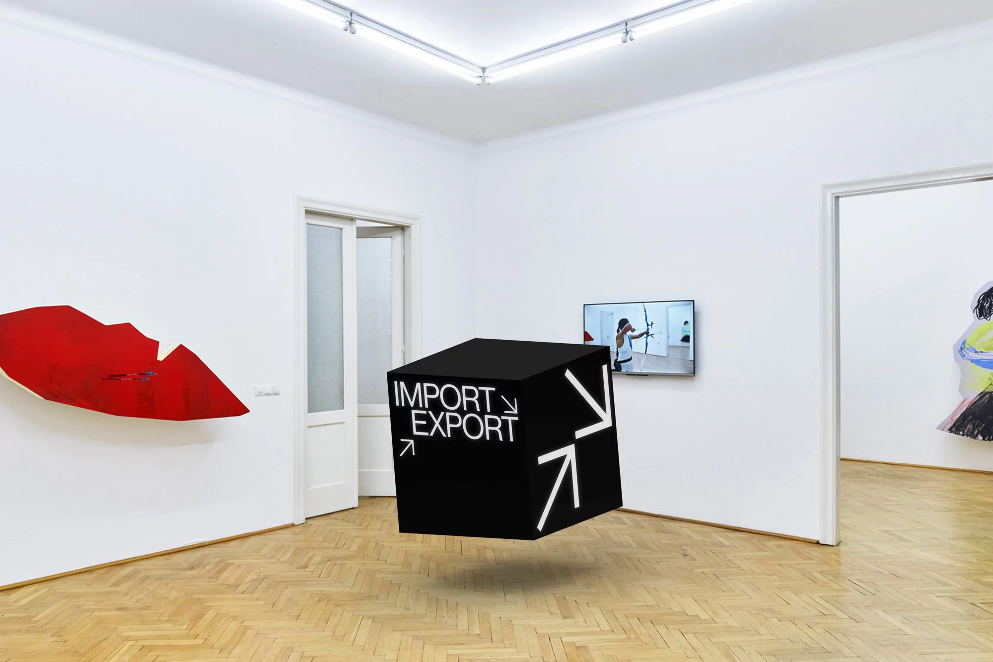 Art gallery featuring a levitating 'Import/Export' cube, red wall art, and a monitor displaying an archer, set against white walls and wood floors.