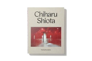 Book cover featuring bold black typography reading Chiharu Shiota and a central photographic inset of a red string installation