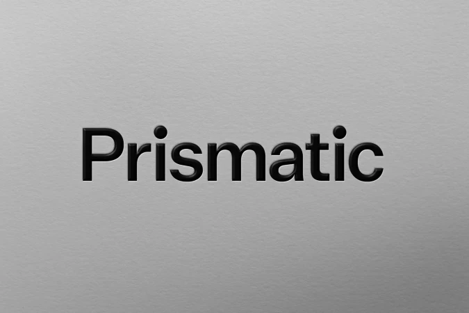 Black sans-serif 'Prismatic' typography on light gray textured background. Clean design featuring modern and minimalist aesthetic.
