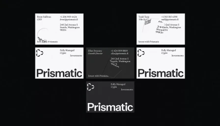 Collection of business cards featuring minimal typography and the Prismatic brand identity displayed on a dark background.