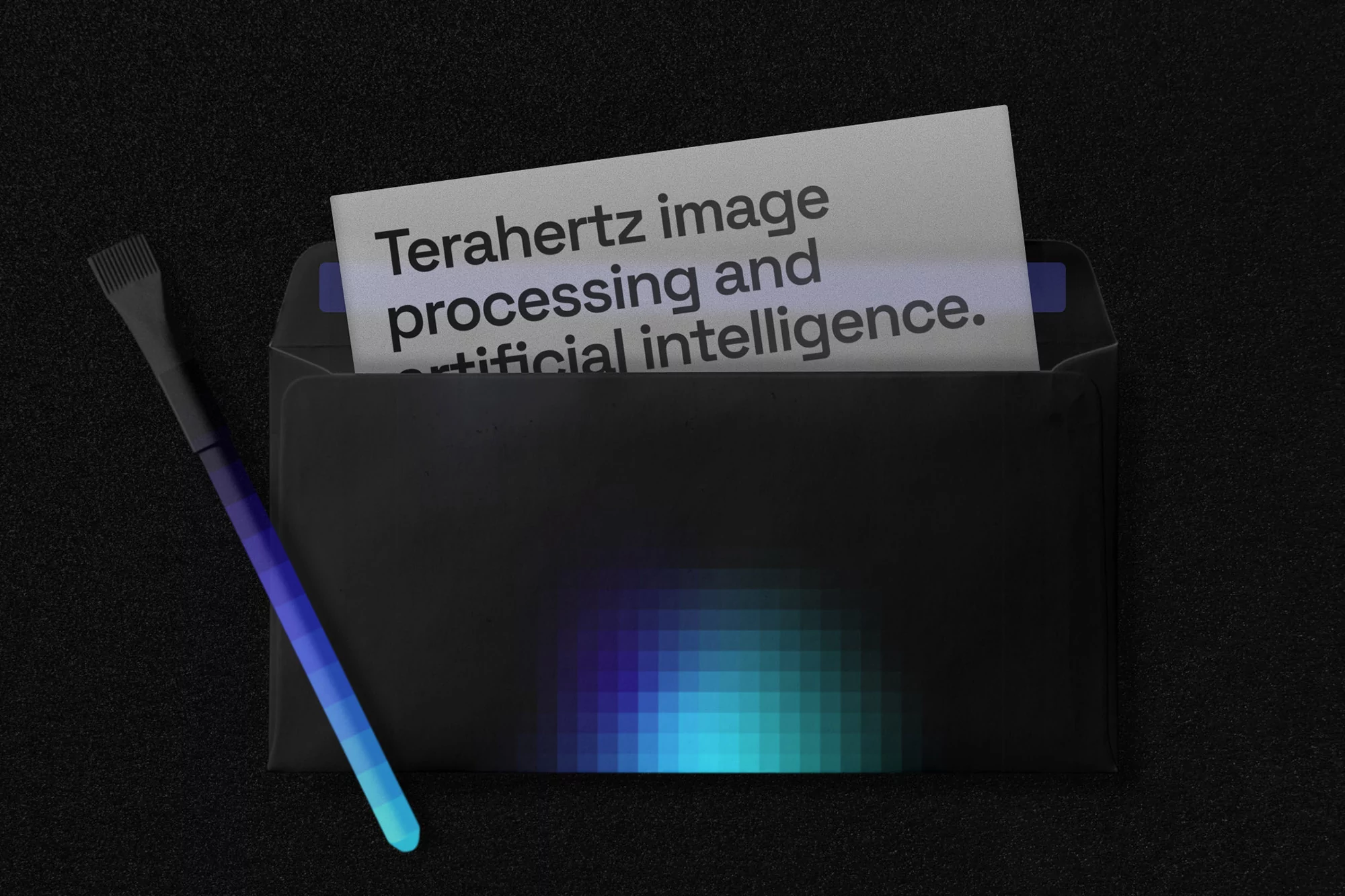 Black envelope with a pixelated design and a brush next to a card with "Terahertz image processing and artificial intelligence" text.