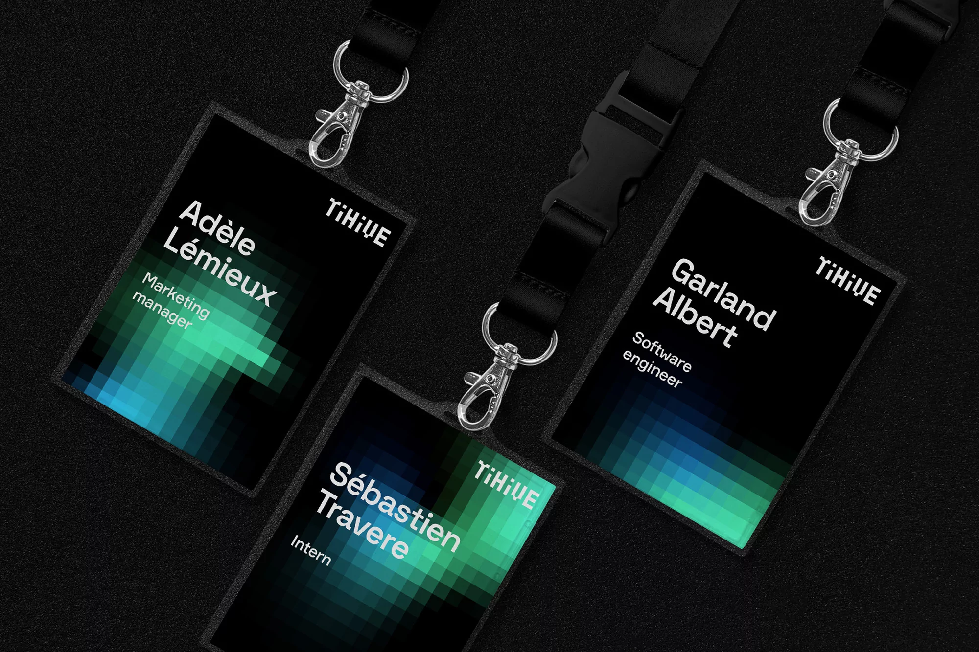Three company ID badges displayed on a black surface, each featuring a name, job title, and the 'Tihive' logo, with gradient accents.