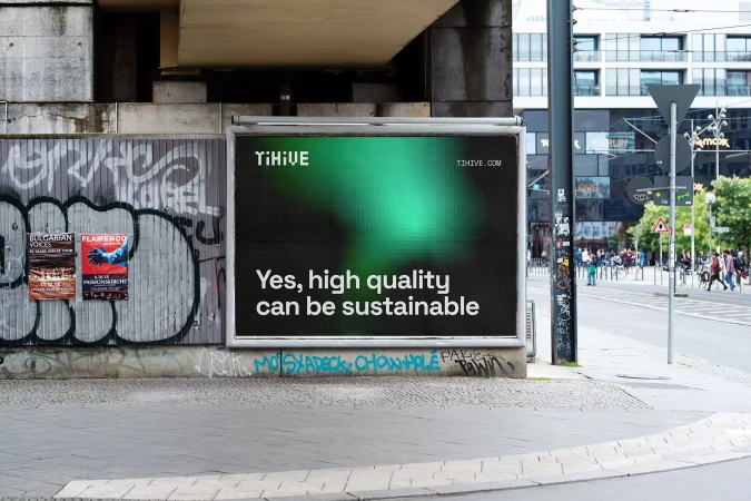 Billboard advertising TiHive.com featuring the text 'Yes, high quality can be sustainable' against a green background in an urban setting.