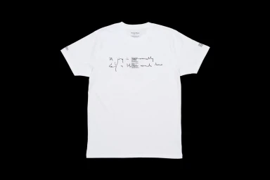 A white t-shirt with black handwritten poetry printed on the chest, isolated against a solid black background.
