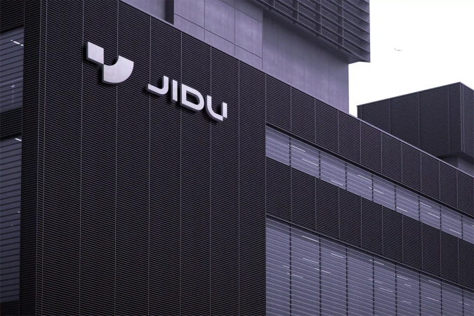 Exterior view of the JIDU headquarters building, showcasing its modern architectural design with the company logo prominently displayed.
