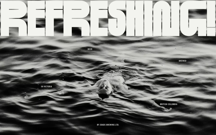 Artistic black and white image of a person swimming in rippled water, complemented by bold typography for a striking visual.