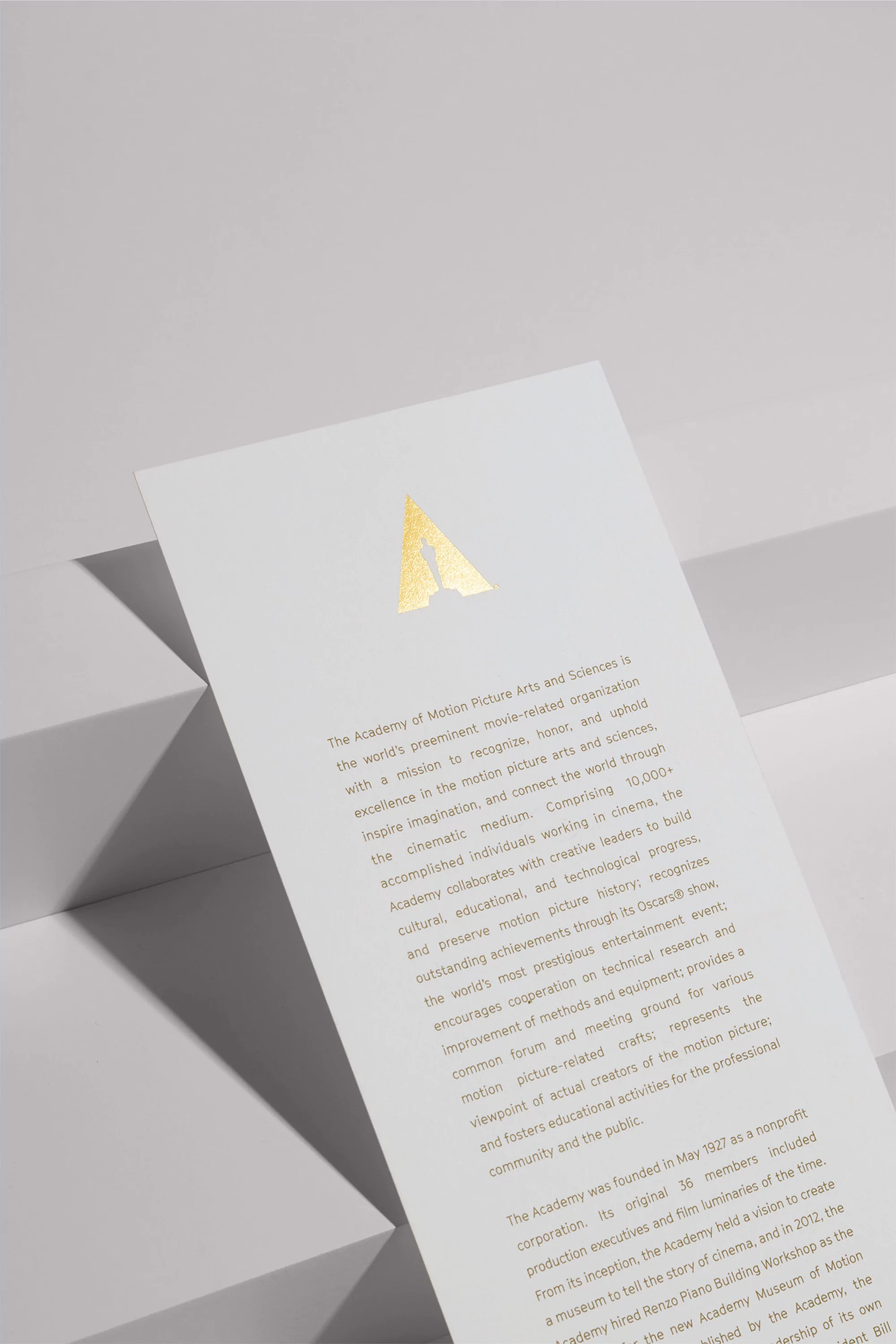 Close-up of The Academy of Motion Picture Arts and Sciences promotional material featuring a logo, text, and stairs background.