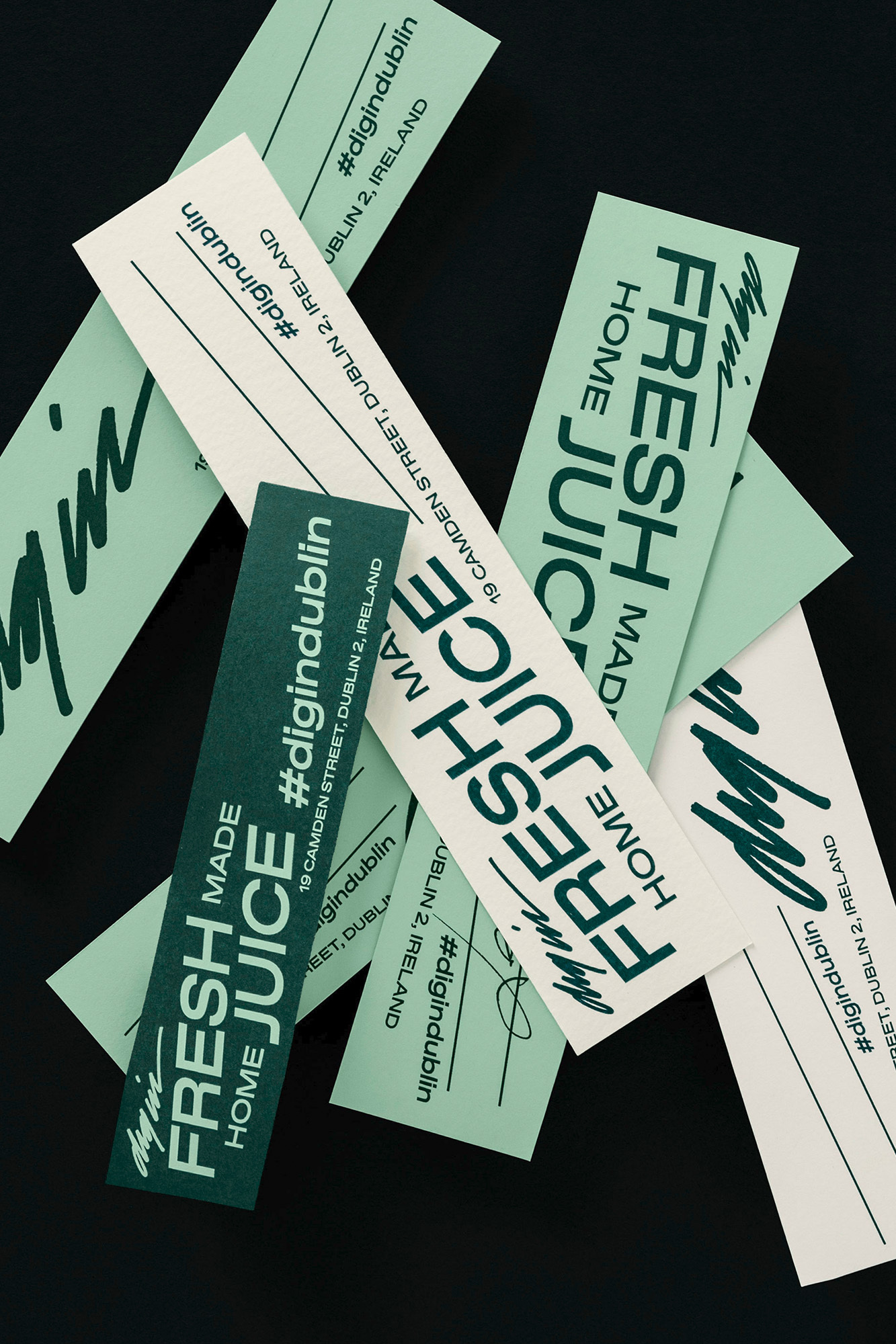 Scattered labels with 'Fresh Juice' and social media handles in light green on cream and dark green on black background.