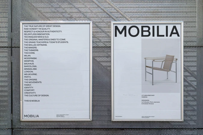 Two framed posters mounted on a wall feature product design advertisements for furniture company Mobilia, showcasing modernist chairs and design philosophy.