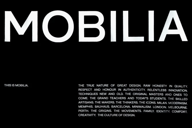 Monochromatic image featuring the word "MOBILIA" in large white text against a black background with smaller text below.