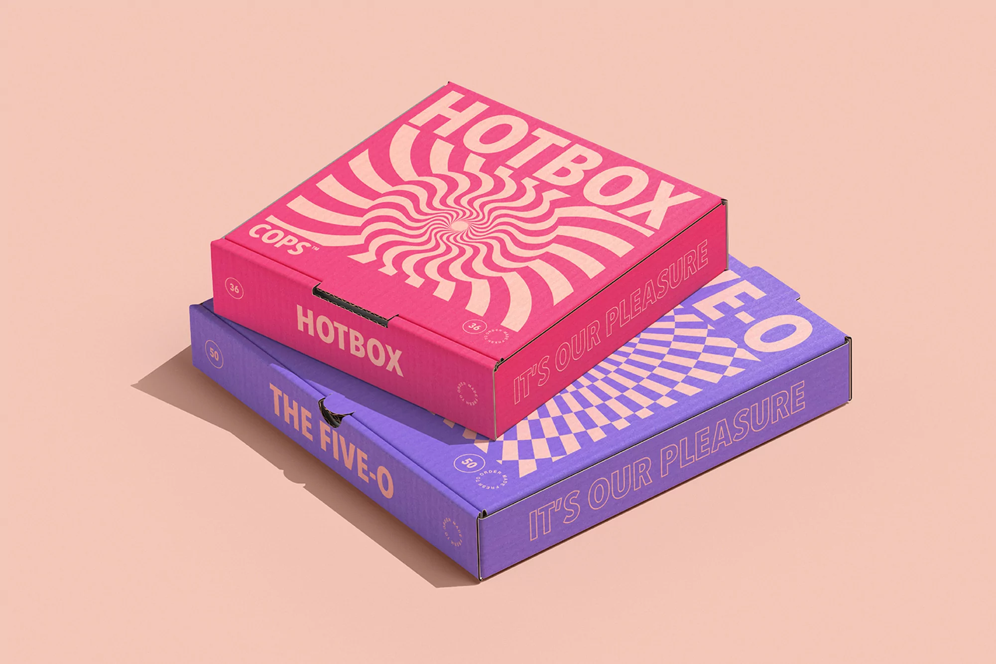 Two stacked cardboard boxes in pink and violet on a peach background with text and a hypnotic swirl design on the pink box.