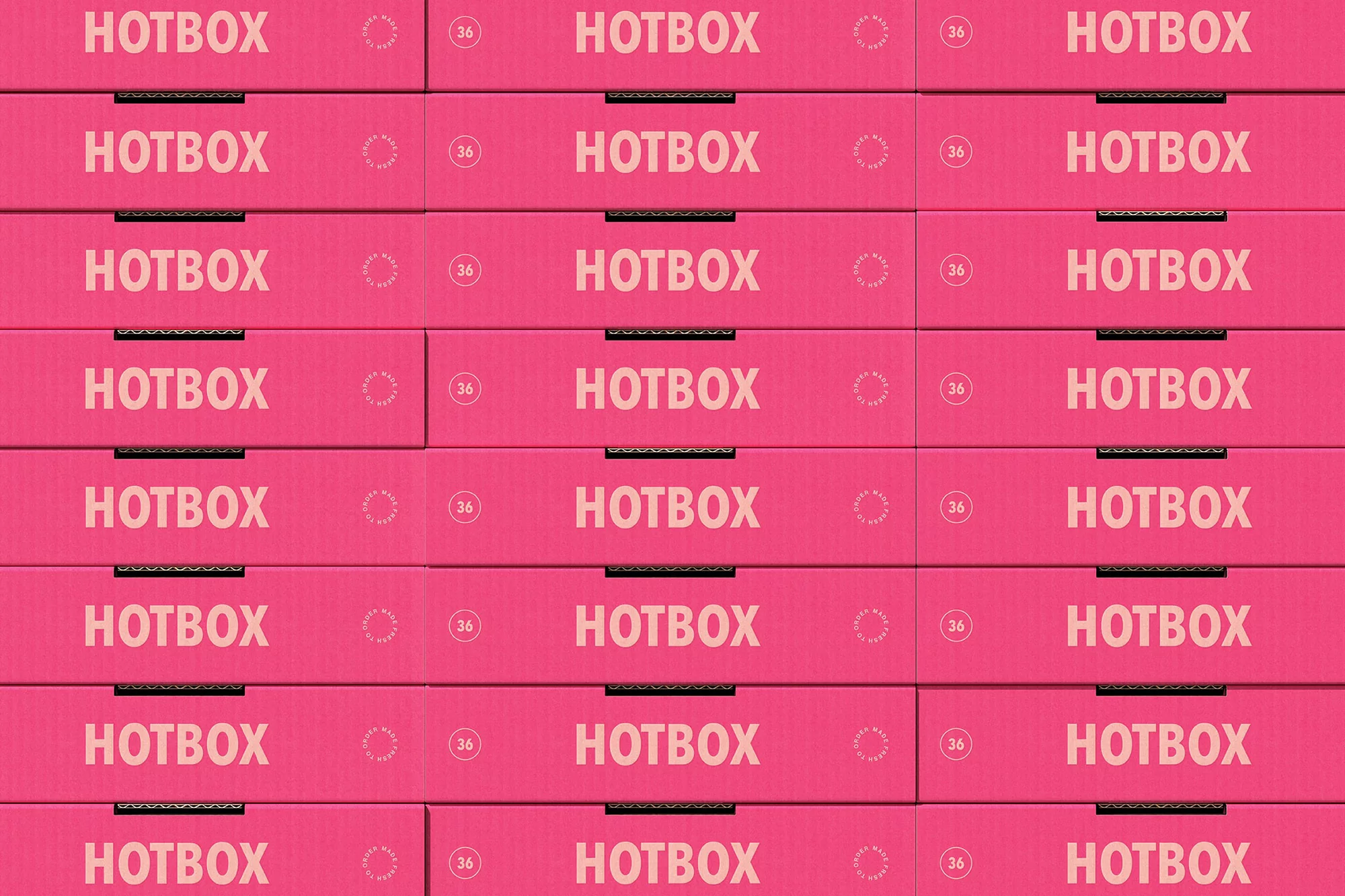 Stacks of pink Hotbox branded cardboard boxes, arranged in rows. The boxes appear to be unopened and new, ready for shipping.