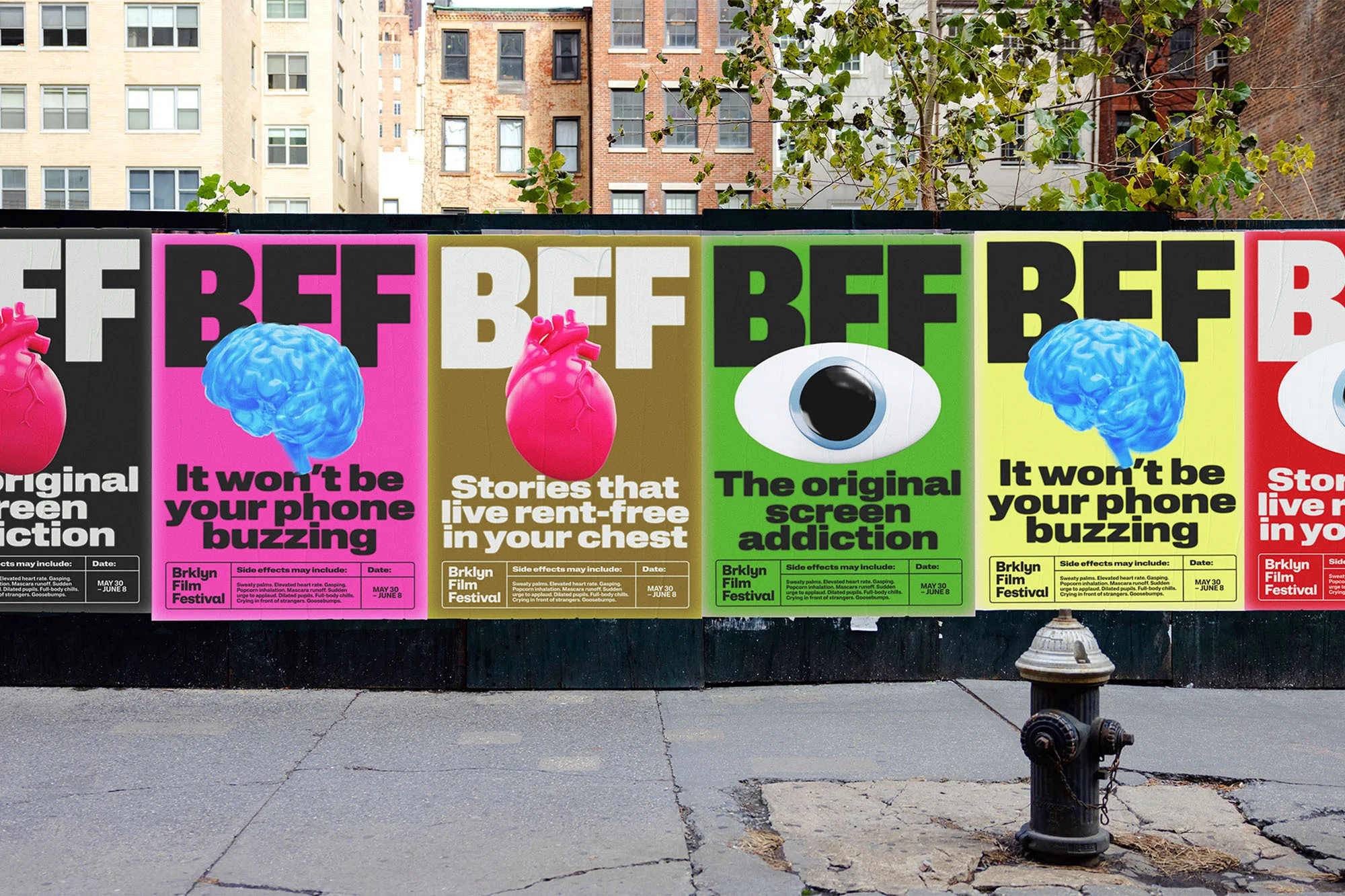 Urban posters promoting the Brklyn Film Festival display vibrant images of brains, hearts, and eyes, with the city visible in the background.