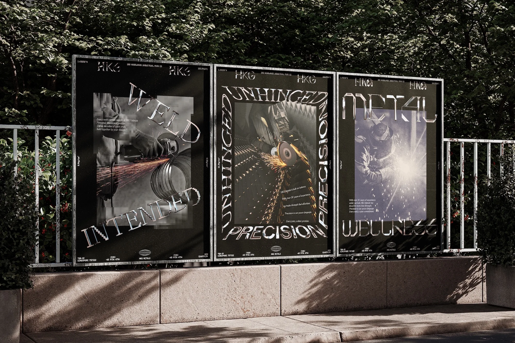 Three industrial posters on a city street, featuring welding and metalwork, with metal lettering and a natural outdoor setting.