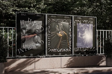 Three black graphic design posters mounted outdoors on a concrete wall featuring metallic typography and industrial imagery by HKG Metals.
