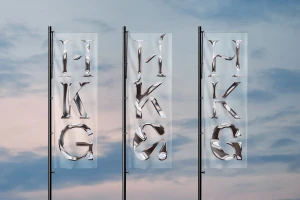 Three vertical semi-transparent flags featuring polished chrome HKG typography against an outdoor cloudy sky background