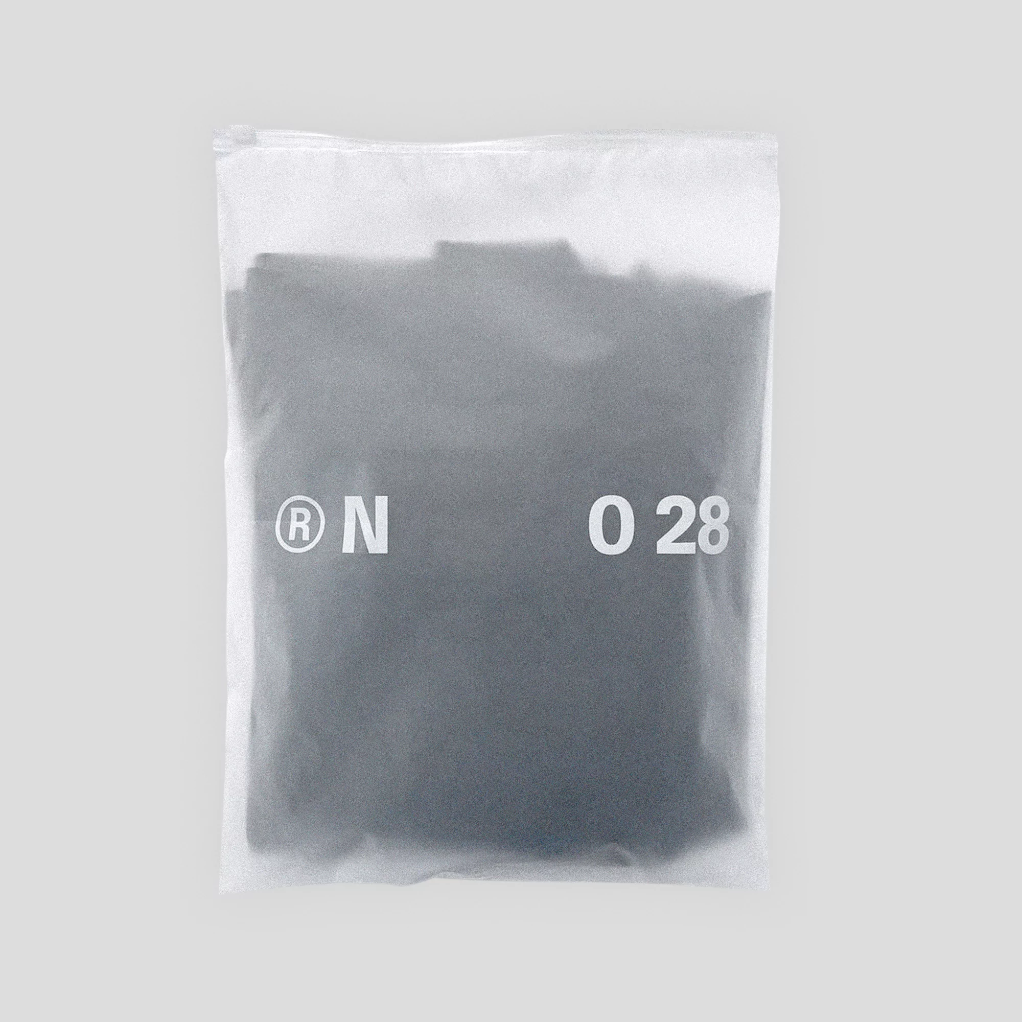 Sealed plastic bag containing a gray folded garment with printed registration mark and the number 028 on a light gray background.
