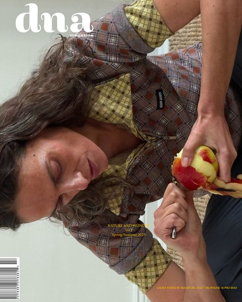 Magazine cover featuring a woman peeling a peach, showcasing fashion, food, and a close-up composition with clear brand visibility.