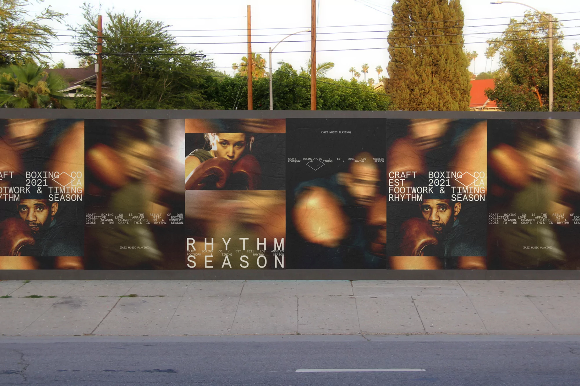 Outdoor view of a street-level billboard featuring athletic boxing imagery and typography advertising 'Rhythm Season' and Craft Boxing Co. in Los Angeles.