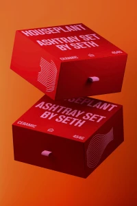 Two stacked red product boxes with white and pink typography against a solid orange gradient background