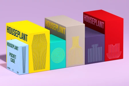 Colorful branded product packaging boxes arranged on a pale purple surface with typography and line art illustrations.