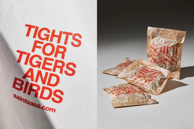 A graphic design featuring the brand 'saintsass.com' in red, displayed on a white cloth and adjacent to packages of the same brand.