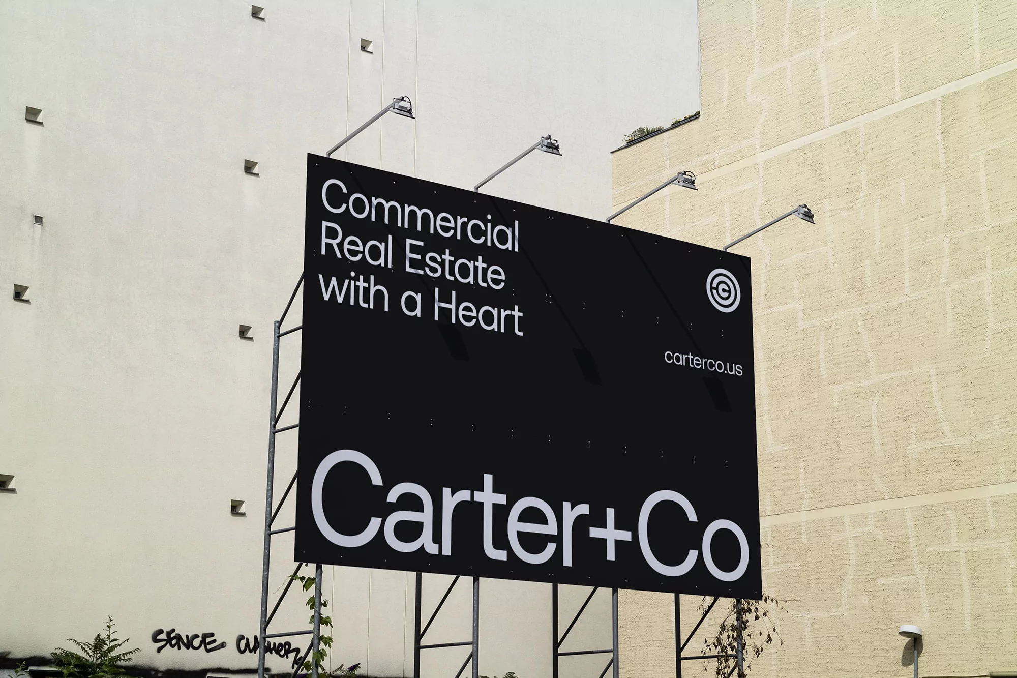 Billboard in an urban environment showcasing commercial real estate advertising with text and logos, set against a light beige building facade.