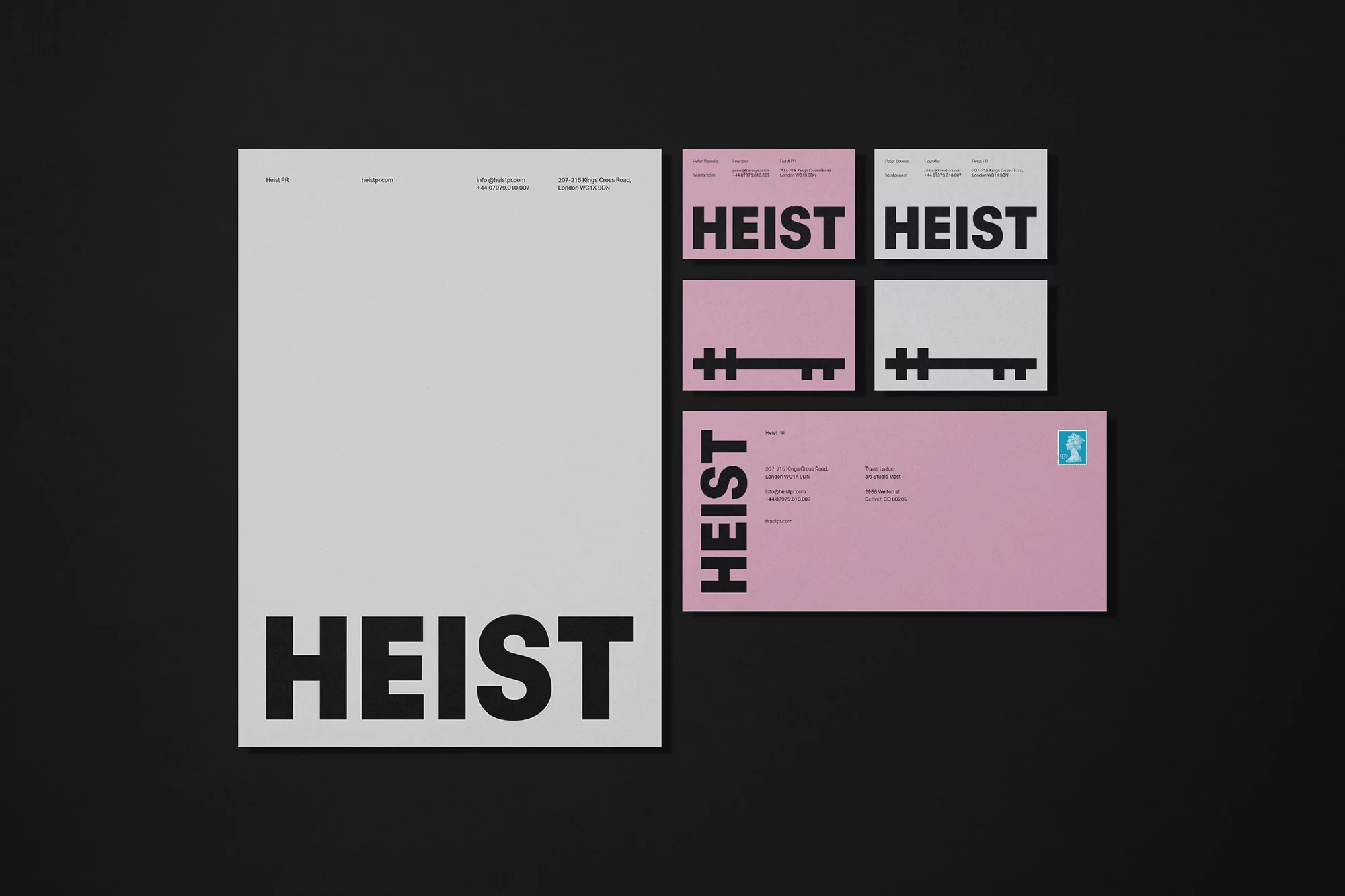 Promotional stationery set featuring a letterhead, business cards, and envelope with the word 'HEIST' in bold typography.