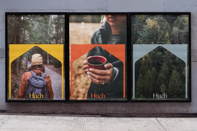 Outdoor posters displaying outdoor images: a woman hiking, a person holding a cup, and a view of pine trees.