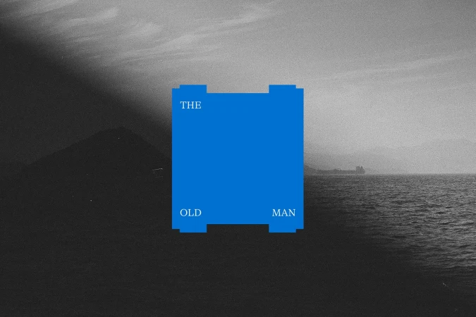 Black and white scenic landscape with a body of water, distant mountains, and a blue graphic with text that reads, 'The Old Man'.