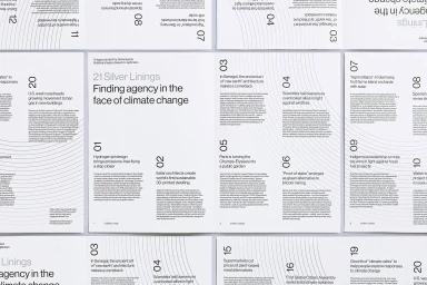 Spread of a minimalist magazine layout featuring black typography and curved contour lines on white paper pages