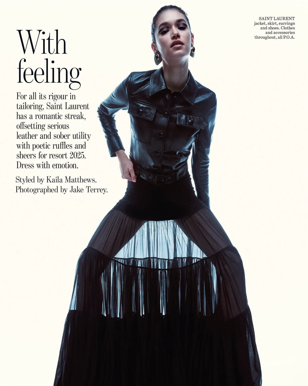 Model wearing a black leather jacket and long sheer skirt against a plain white background in a Vogue Australia fashion editorial.