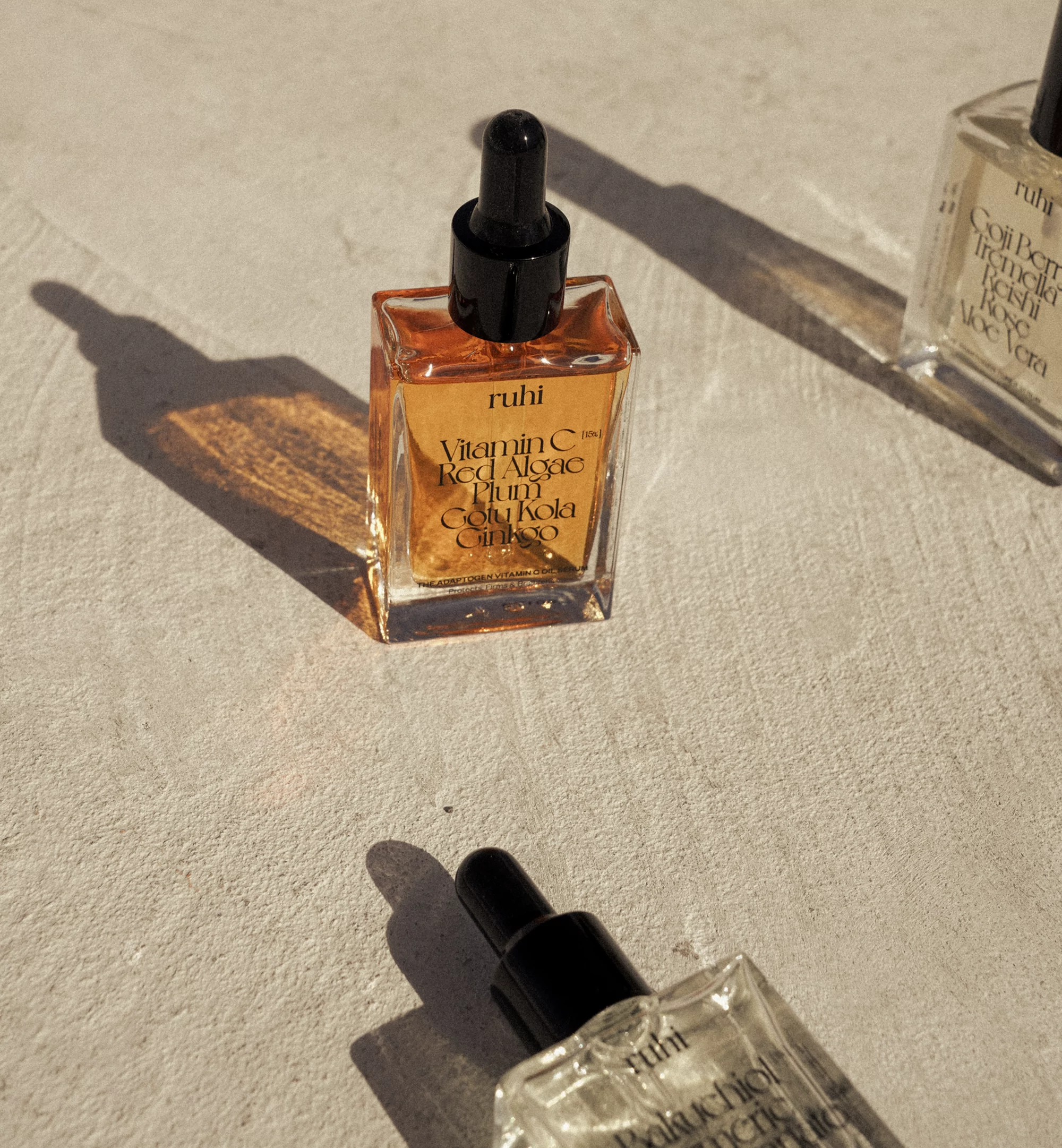 Close-up of Ruhi skincare product bottles in a photo studio with natural lighting, showcasing skincare and beauty concept.