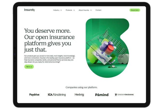 Insurely website displayed on a tablet screen featuring abstract shapes and colors, highlighting the insurance platform's interface.
