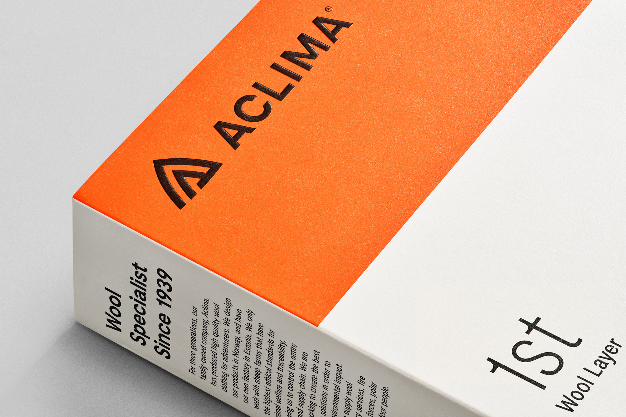Close-up of an Aclima wool specialist product box with the company logo and description of wool clothing for adventurers.