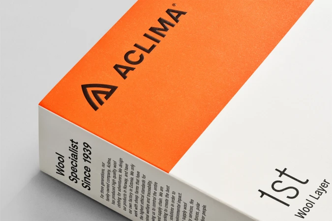 Close-up of an Aclima wool specialist product box with the company logo and description of wool clothing for adventurers.