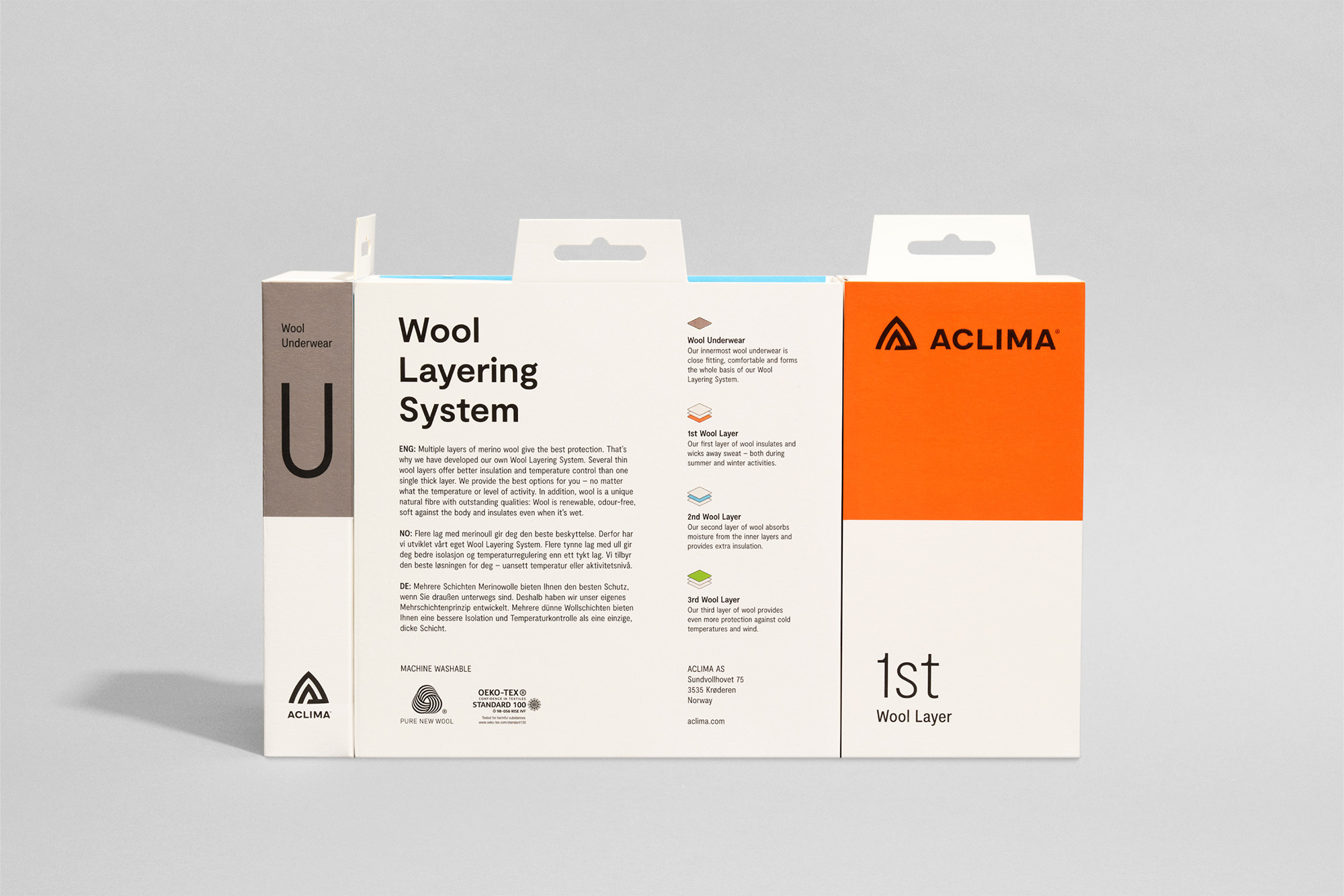 Wool Underwear Layering System box by Aclima featuring a minimalist design in white and orange, showcasing the brand logo.