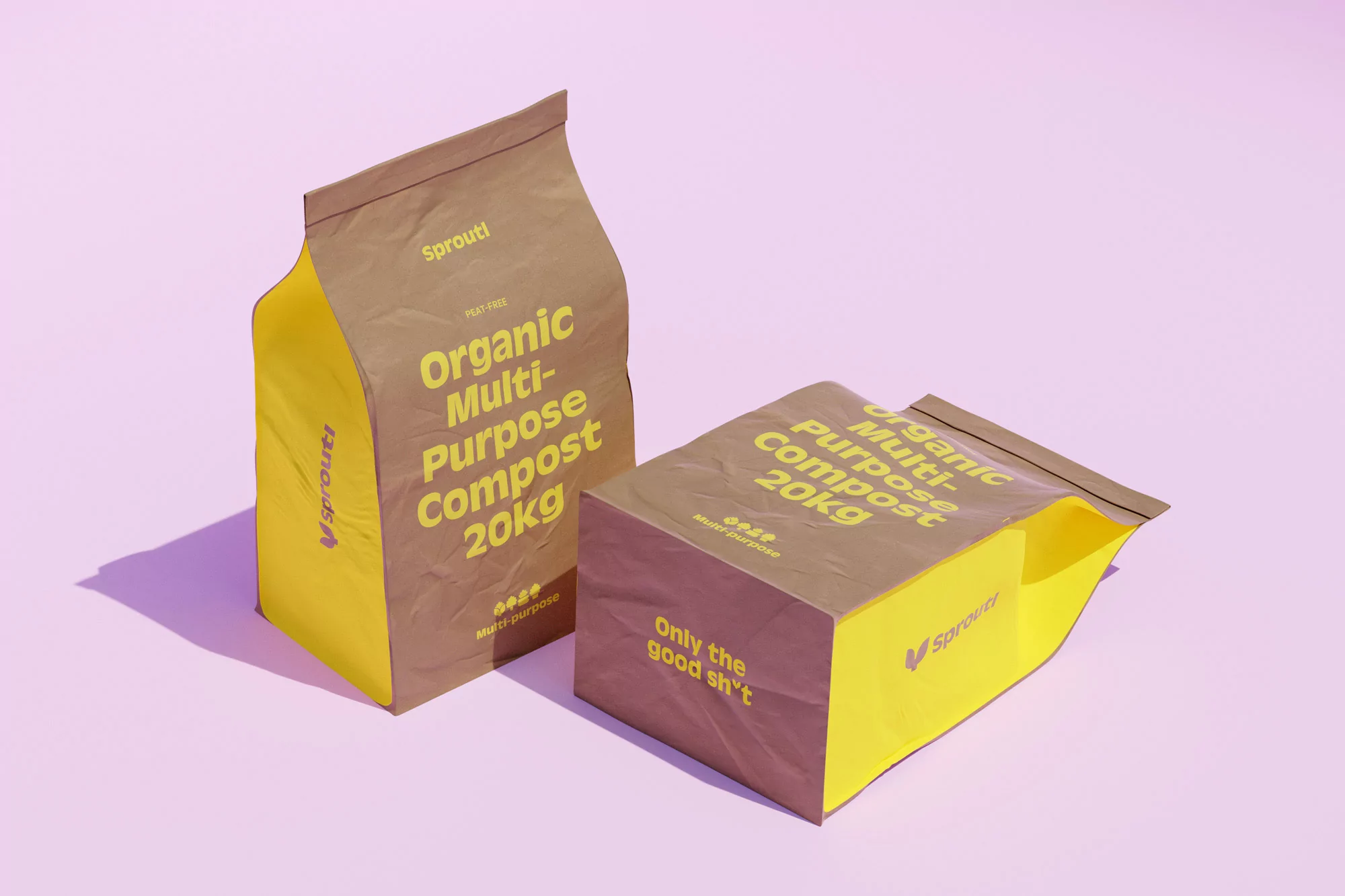 Two Sprout! organic multi-purpose compost 20kg bags, one upright and one angled, displayed on a light pink seamless background in studio lighting.