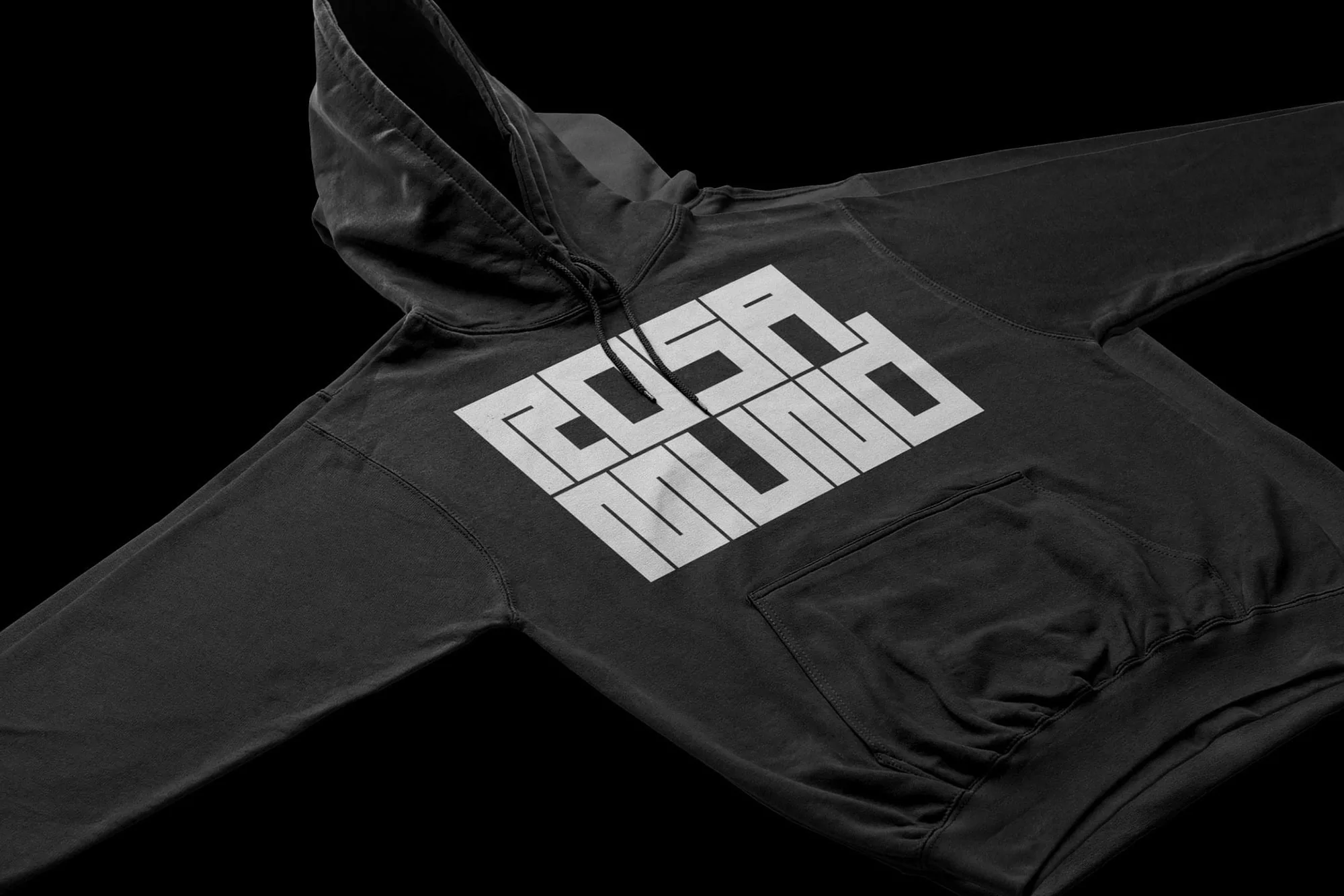 Black hooded sweatshirt with white ROSA MUNDO text logo, close-up product shot on a dark background, minimal style.