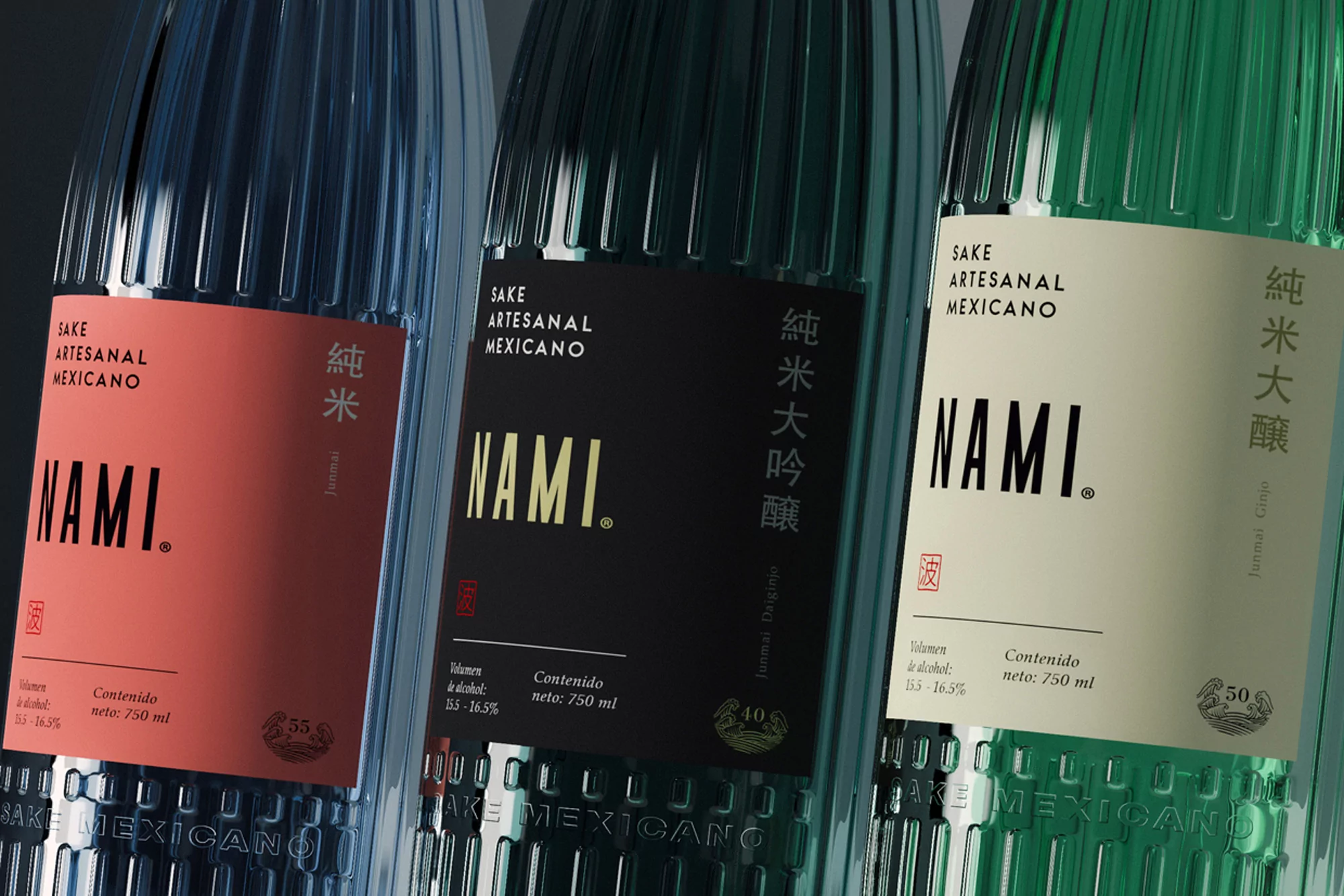 Three colorful bottles of Nami Sake Artesanal Mexicano are lined up against a dark background, each with a label and a ridged texture.
