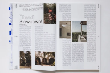 Spotted double-page magazine spread featuring architectural photography and typography for Archisearch