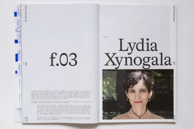 Open magazine spread for Archisearch featuring editorial layout with bold typography, profile photography, and Greek text columns.