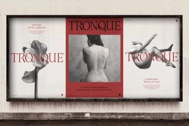 Billboard display featuring three vertical posters with red and black typography and monochrome imagery by Marx Design