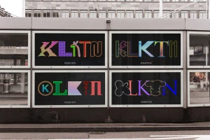 KLKTN brand identity display featuring four large framed typographic posters mounted on an urban building exterior.
