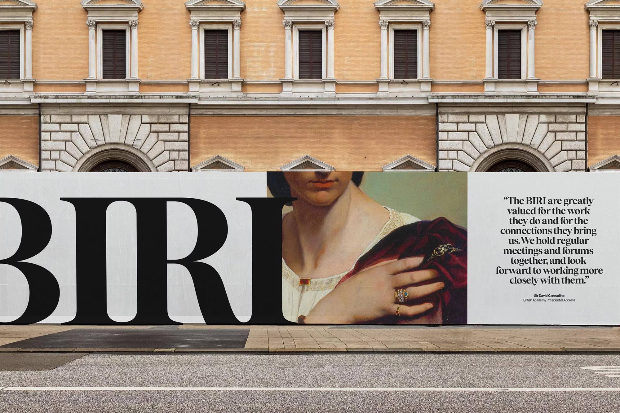 Building facade with a large advertisement featuring artwork and text 'BIRI,' offering a glimpse into art and architectural design.