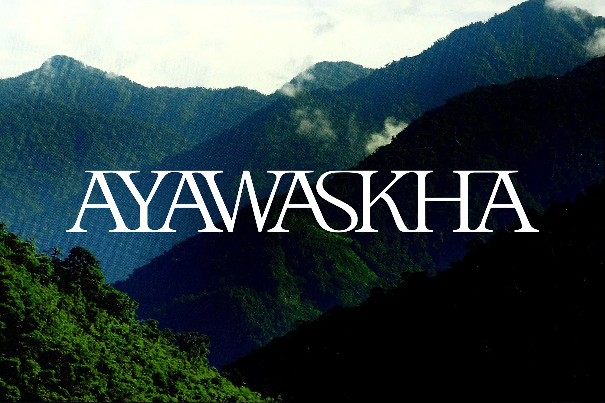 Lush green mountain range landscape under a cloudy sky, with bold white text overlayed at the center of the image.