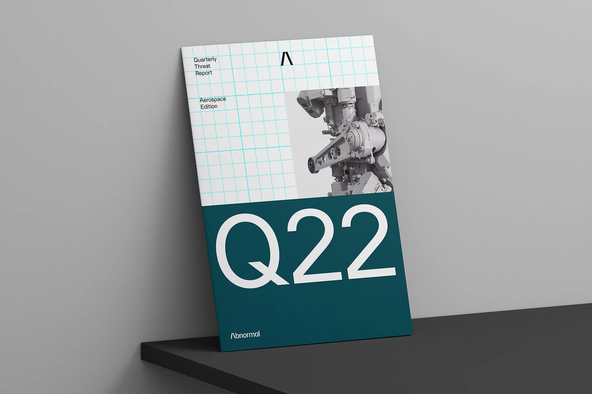 Quarterly threat report cover in teal and white, featuring an illustration of machinery and graph paper-style grid in the background.