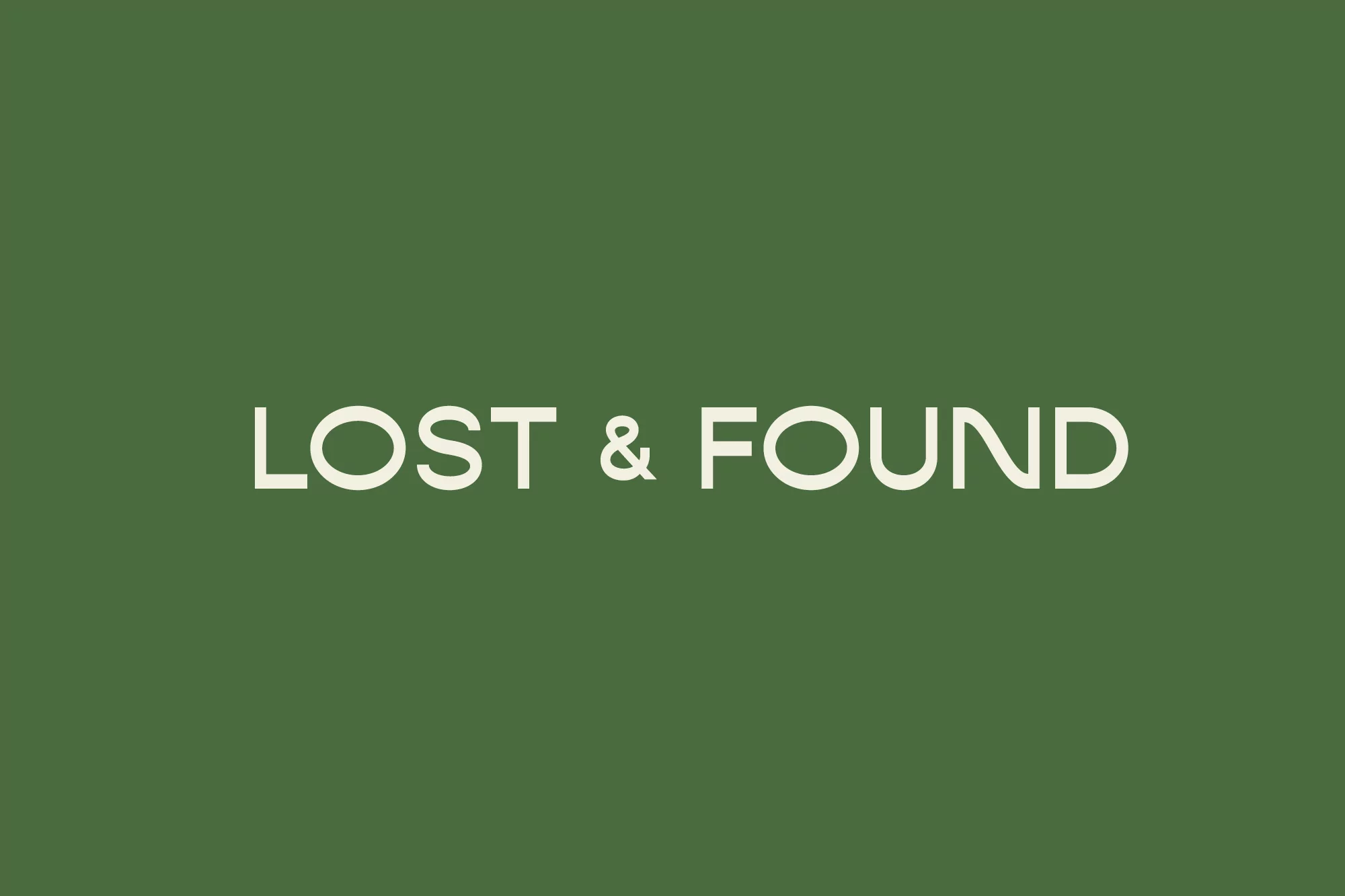 Text art with 'LOST & FOUND' in white font against a solid dark green background, creating a clean and minimalist design.