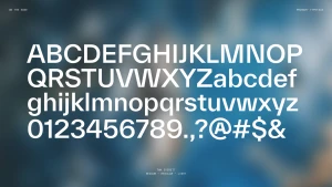 Typography showcase featuring upper and lowercase alphabet letters in a clean sans-serif font set against a blurred blue background.