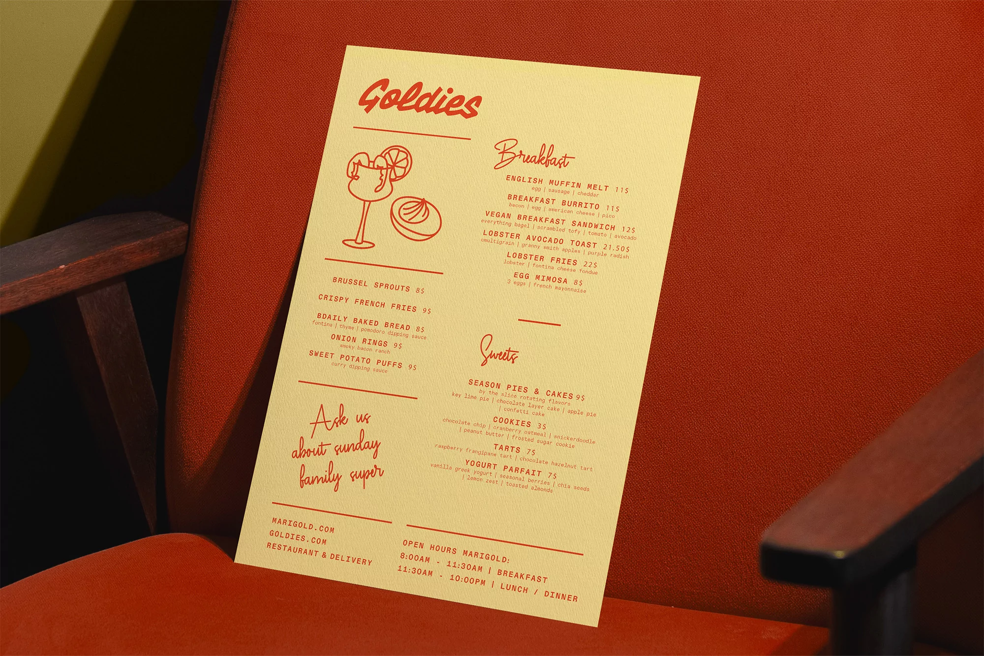 Restaurant menu on a red armchair displaying food and drink options like breakfast burritos, lobster fries, and seasonal pies and cakes.